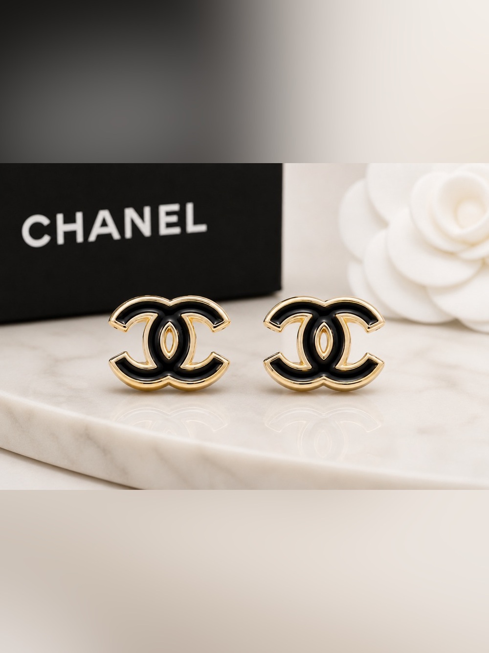 CHANEL Black and gold Interlocking CC Hair Clips